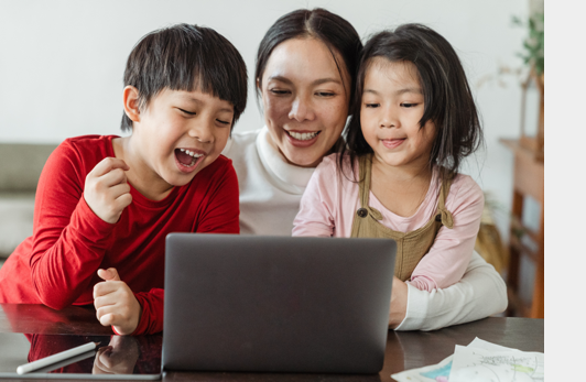 Mother and children around a laptop